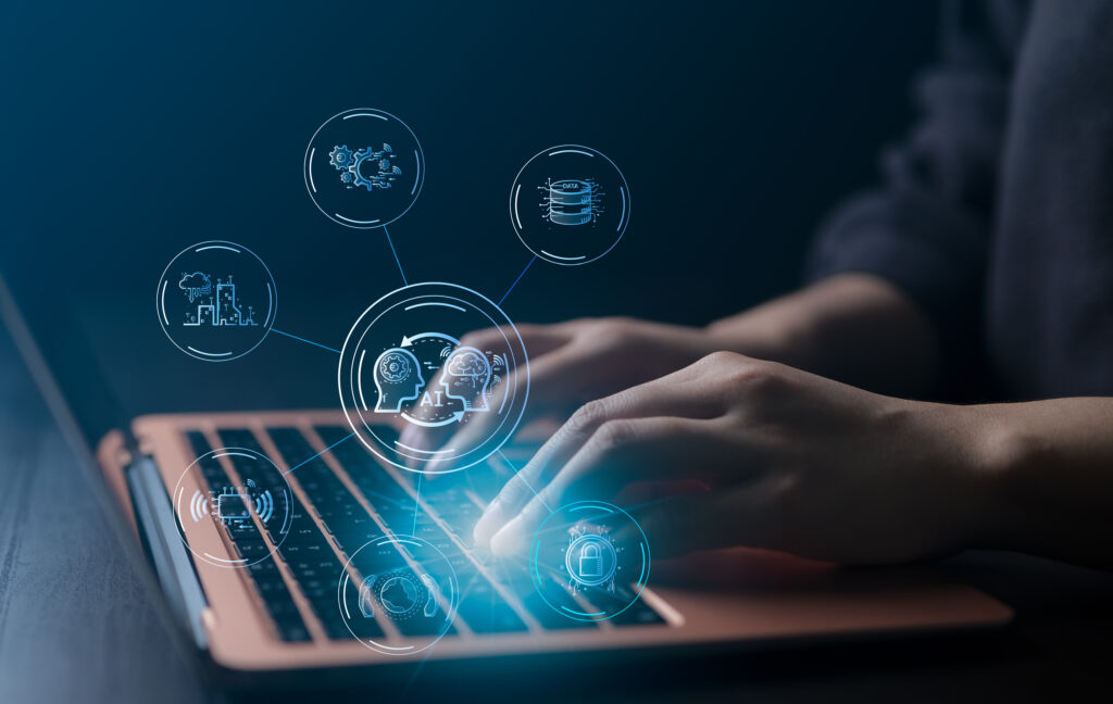 innovative technology solutions Hands typing on a laptop keyboard with digitally rendered technology and cybersecurity icons floating above the device, illustrating seamless integration for maximizing efficiency in modern tech environments. IT services